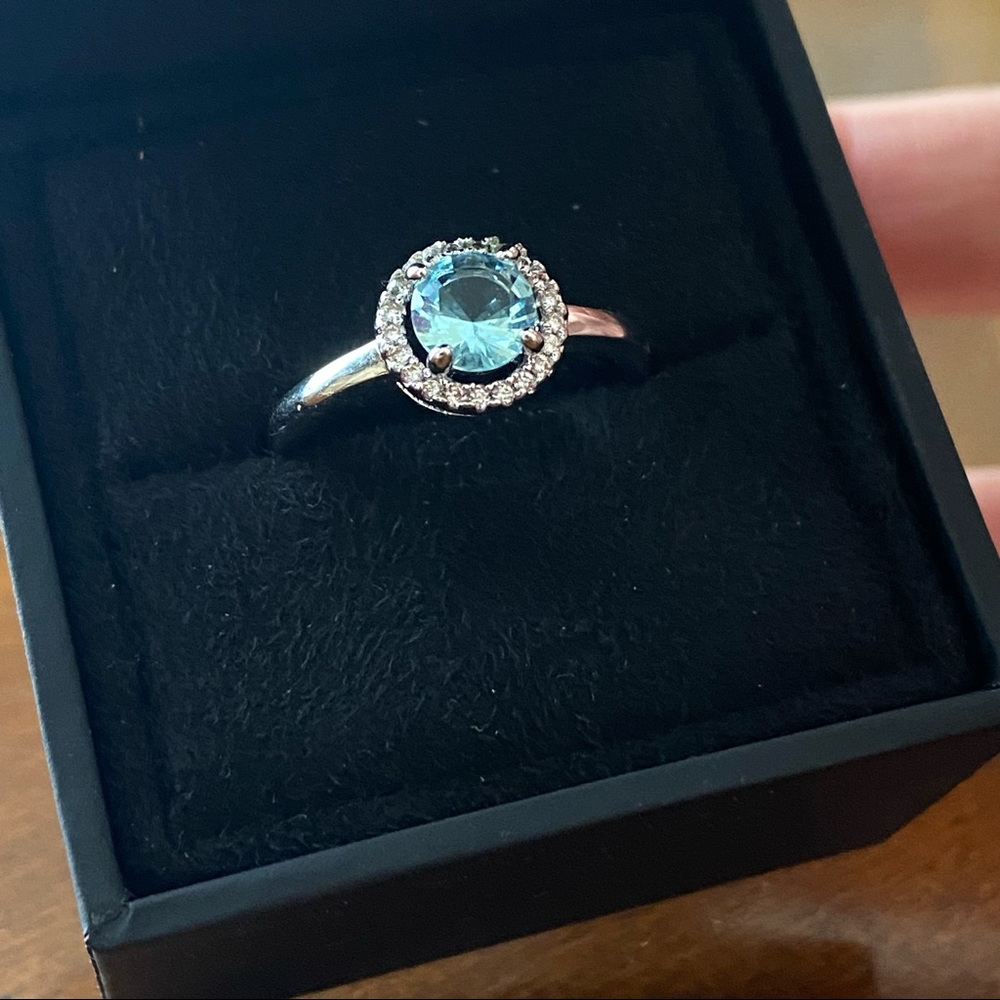 Ring (size 9) round aqua blue stone with small white CZ